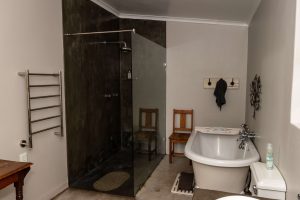 A frameless shower with tinted glass