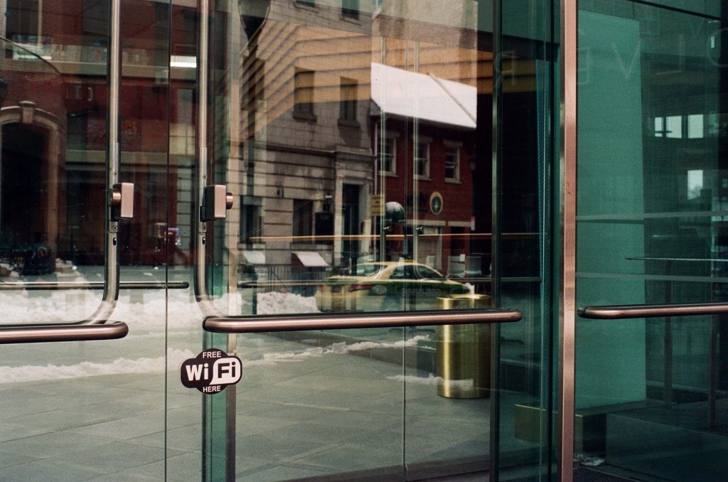 A glass door with a free WiFi sticker