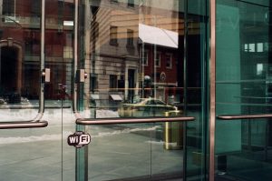 A glass door with a free WiFi sticker